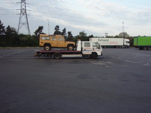 Land Rover on the back of pickup truck